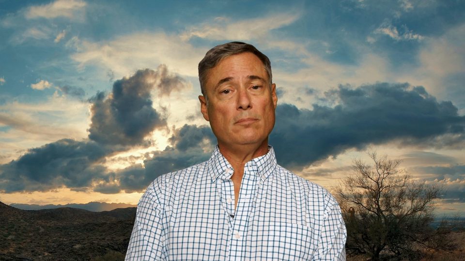 Todd Balash against a desert sky at sunset